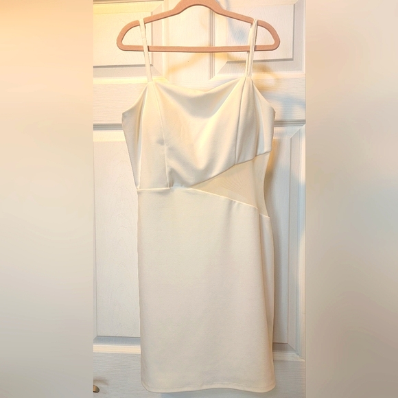 Trixxi Dresses & Skirts - Juniors size medium white dress, with mesh piece on the side